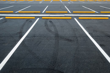 Yellow Bumper Blocks In Parking Lot